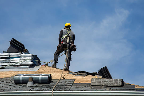Professional Roof Replacement technician working in Bennington, IN